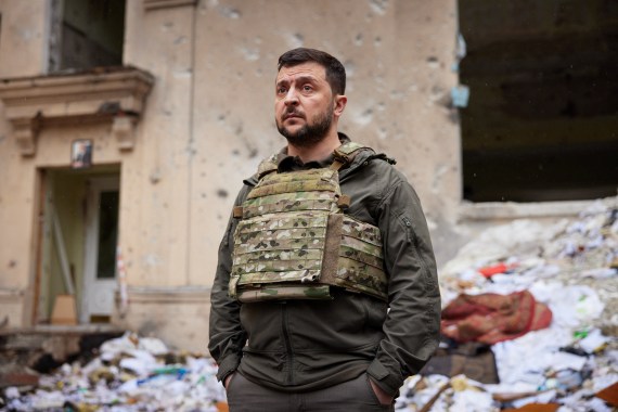 Ukraine's President Volodymyr Zelenskyy visits an area damaged by Russian military strikes.