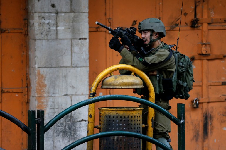 A member of Israeli forces is seen in Hebron in occupied West Bank.