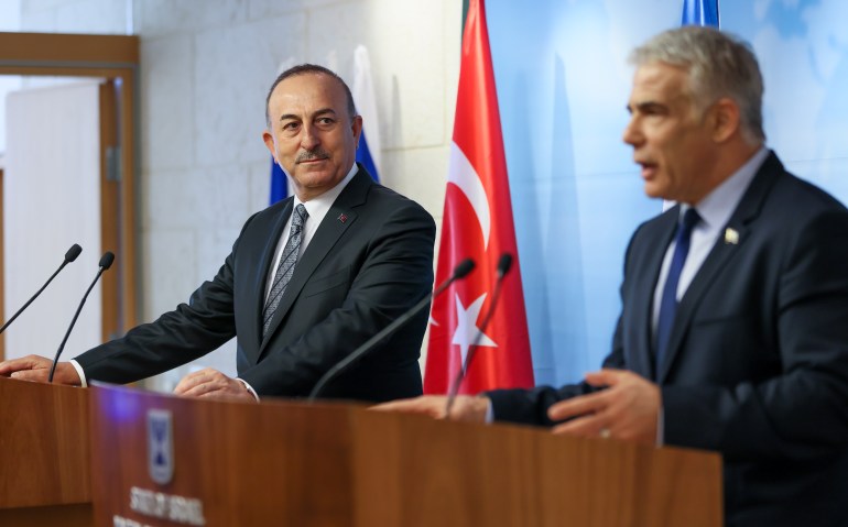 Turkish Foreign Minister Mevlut CaTurkish Foreign Minister Mevlut Cavusoglu (L) and Israeli Foreign Minister Yair Lapid (R) hold a joint press conferencevusoglu in Jerusalem