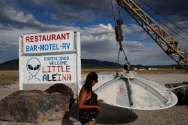 A UFO display outside the Little A&#39;Le&#39;Inn cafe and motel, in Rachel, Nevada., the closest town to Area 51 - the secretive US Air Force base long associated with UFOs by enthusiasts of unexplained sightings [File: John Locher/AP]