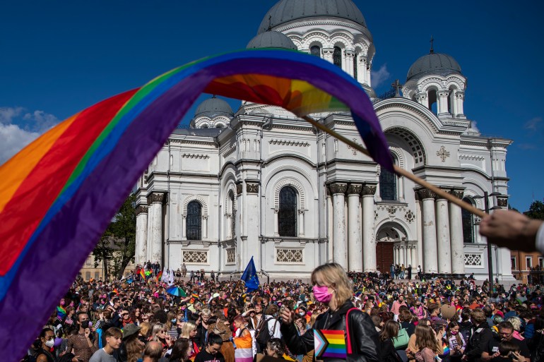 People are seen taking part in a gay pride parade in Kaunas, Lithuania