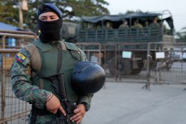 A soldier guards the Litoral penitentiary after a deadly prison riot, in Guayaquil, Ecuador.
