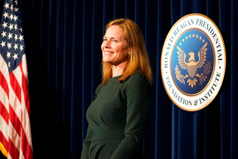 Supreme Court Associate Justice Amy Coney Barrett smiles at the end of a talk at the Ronald Reagan Presidential Library Foundation in Simi Valley, California.