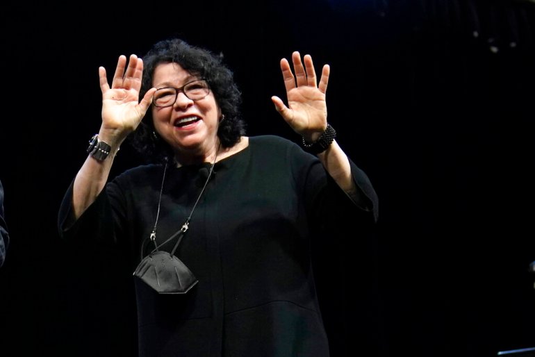 Supreme Court Associate Justice Sonia Sotomayor waves after speaking during an event at Washington University in St. Louis