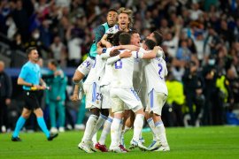 Real Madrid players celebrate at the end of the Champions League semi final.