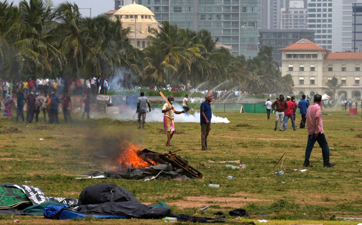 Sri Lanka's pro government supporters vandalise the camps of anti government protestors outside the president's office in Colombo