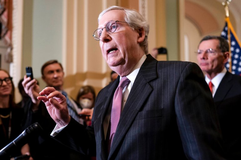 Senate Minority Leader Mitch McConnell, R-Ky., speaks to reporters ahead of a procedural vote on Wednesday to essentially codify Roe v. Wade, at the Capitol in Washington.