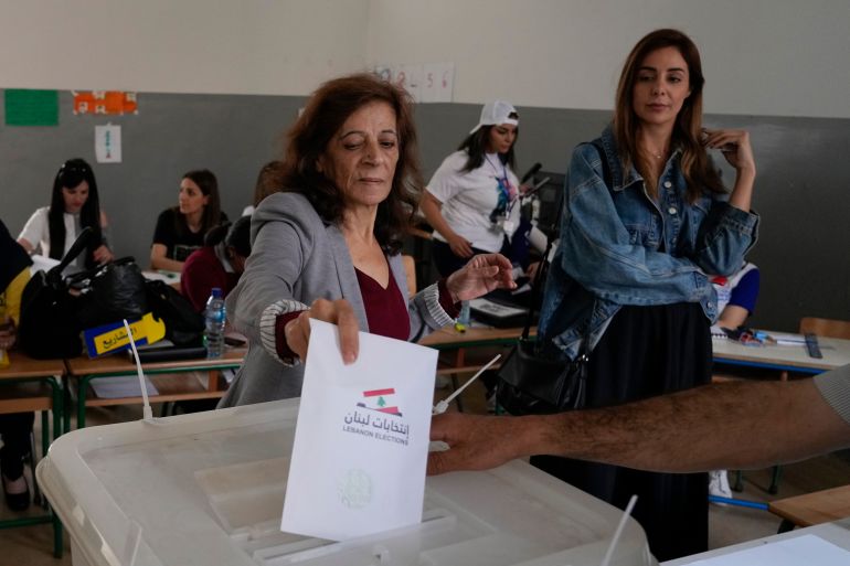 A woman votes during parliamentary elections in Tripoli