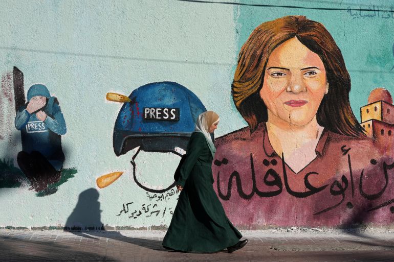 A mural of slain of Al Jazeera journalist Shireen Abu Akleh adorns a wall, in Gaza City, Sunday, May 15, 2022. Abu Akleh was shot and killed while covering an Israeli raid in the occupied West Bank town of Jenin on May 11, 2022