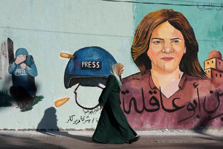 A mural of slain Al Jazeera journalist Shireen Abu Akleh adorns a wall in Gaza City.