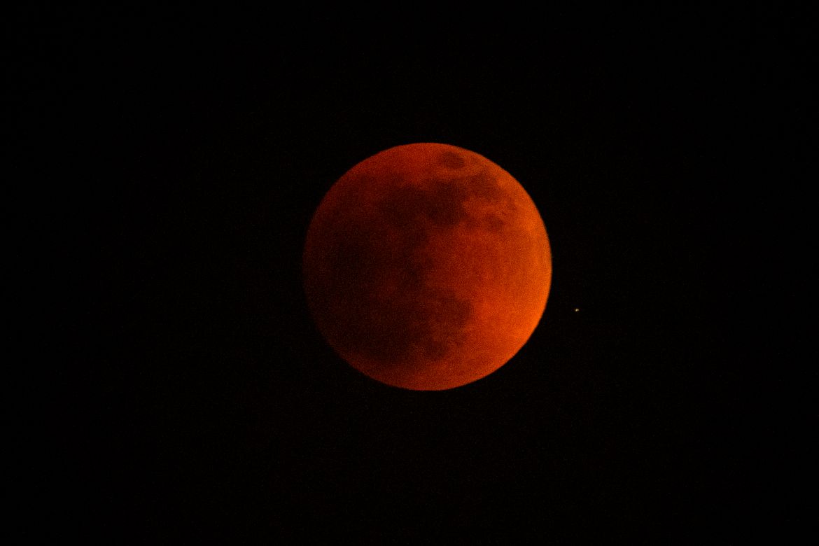 A total lunar eclipse is seen during the first blood moon of the year, in Temple City, Calif.
