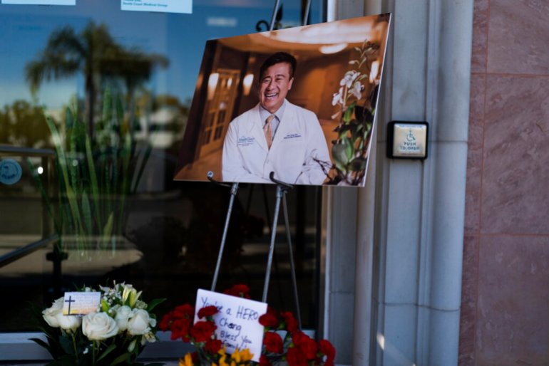 A photo of Dr. John Cheng, a 52-year-old victim who was killed in Sunday's shooting at Geneva Presbyterian Church, is displayed outside his office in Aliso Viejo, California.