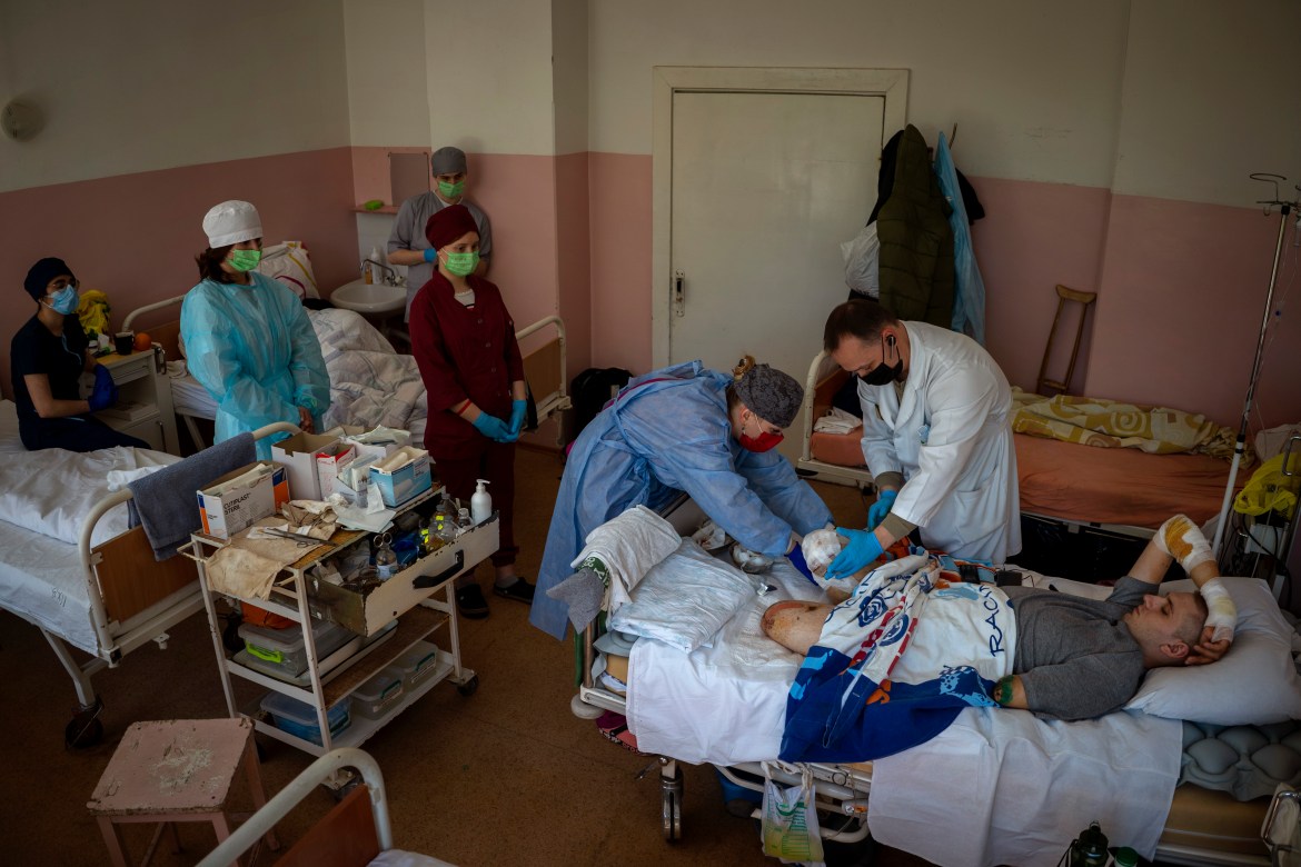 22-year-old Anton Gladun has his wounds cleaned by doctors at the Third City Hospital, in Cherkasy, Ukraine