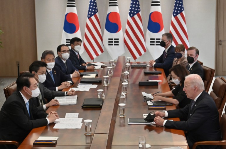US President Joe Biden talks with South Korean President Yoon Suk Yeol during their meeting at the People's House in Seoul Saturday, May 21, 2022.