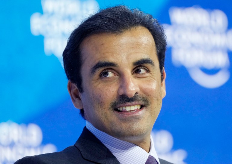 The Emir of Qatar, Sheikh Tamim bin Hamad Al Thani smiles during the World Economic Forum in Davos, Switzerland