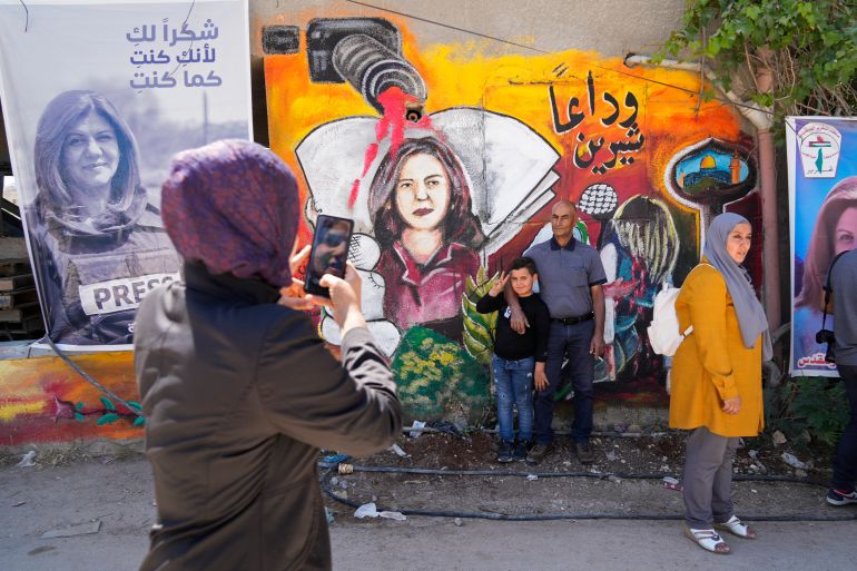 Palestinians visit the site where Shireen Abu Akleh was shot and killed, in the occupied West Bank city of Jenin on May 18, 2022 [Majdi Mohammed/AP]