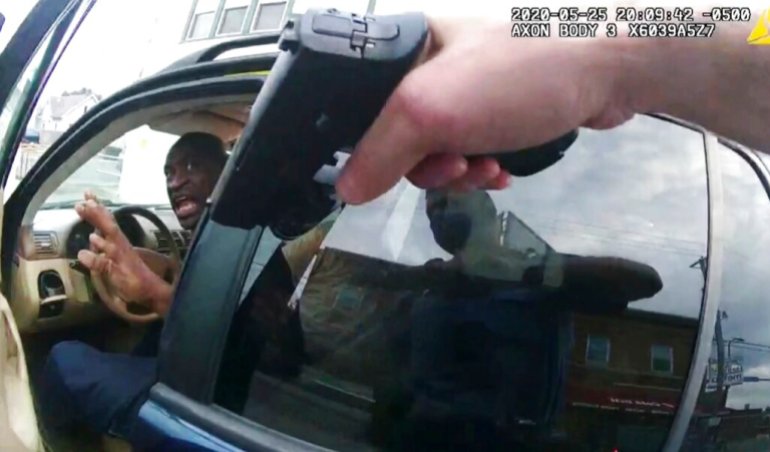 George Floyd responds to police after they approached his car outside Cup Foods in Minneapolis in this May 25, 2020, file pool photo from police body camera video. 