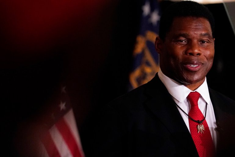 U.S. Senate candidate Herschel Walker speaks to supporters during an election night watch party.