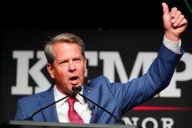 Republican Governor Brian Kemp gave a victorious thumbs-up to supporters during an election night watch party in Atlanta, Georgia [John Bazemore/AP Photo]