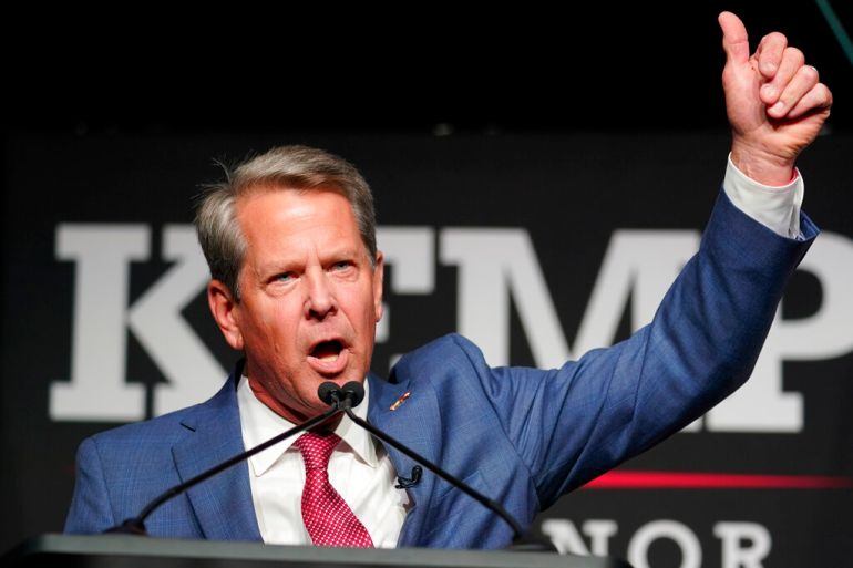 Republican Gov. Brian Kemp waves to supporters during an election night watch party,