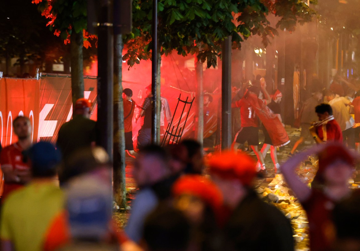 Liverpool supporters react as Real Madrid win the Champions League Final at the fan park in Paris