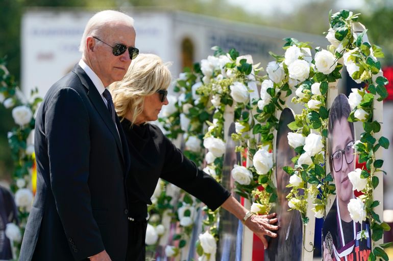 US President Joe Biden and First Lady Jill Biden visit a memorial at Robb Elementary School to victims of the mass shooting in Uvalde, Texas