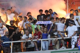 Fans of Hajduk Split celebrate after their team wins in a UEFA Europa League, second round qualifier in 2013 [File photo: Boris Grdanoski/AP]
