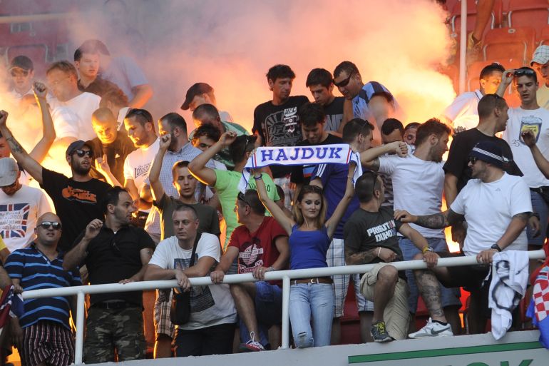 Fans of Hajduk Split celebrate after their team completed the victory in a UEFA Europa League, second round qualifier against Horizont Turnovo, at Philip II Arena in Skopje, Macedonia, Thursday, July 25, 2013.