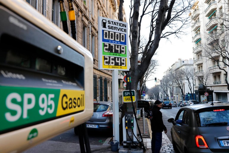 A car stops in a gas station where prices are up to 2,75 euros per liter (US dlrs. 3.04) in Marseille, southern France