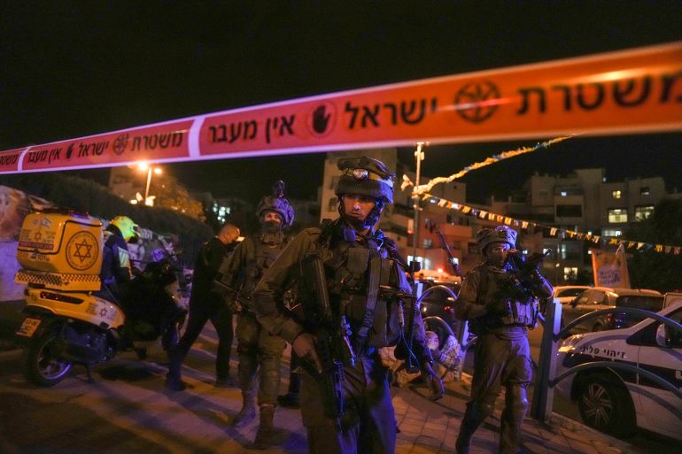 Israeli forces secure the area of a stabbing attack in the town of Elad, Israel.