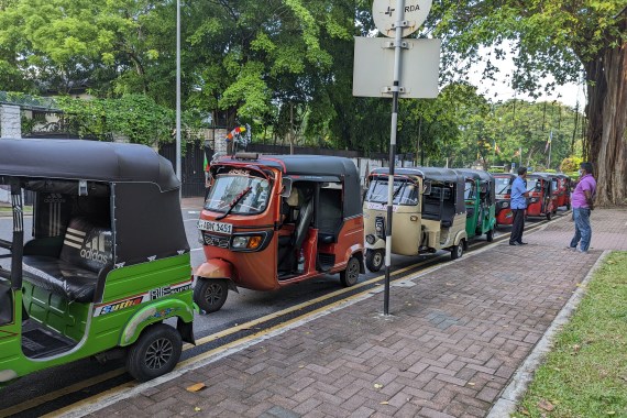 Autorickshaw drivers queue for fuel