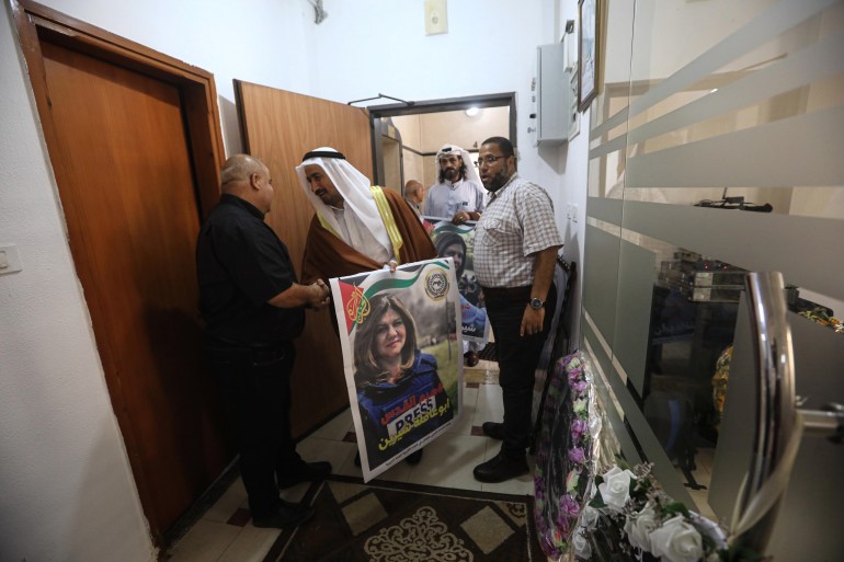 Visitors visit the Al Jazeera office in Gaza.