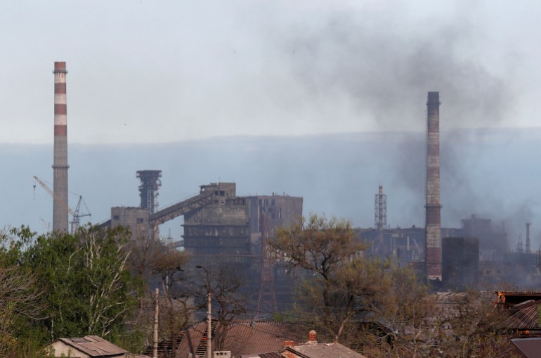 Smoke rises above a plant of Azovstal Iron and Steel Works in the southern port city of Mariupol, Ukraine May 3, 2022.