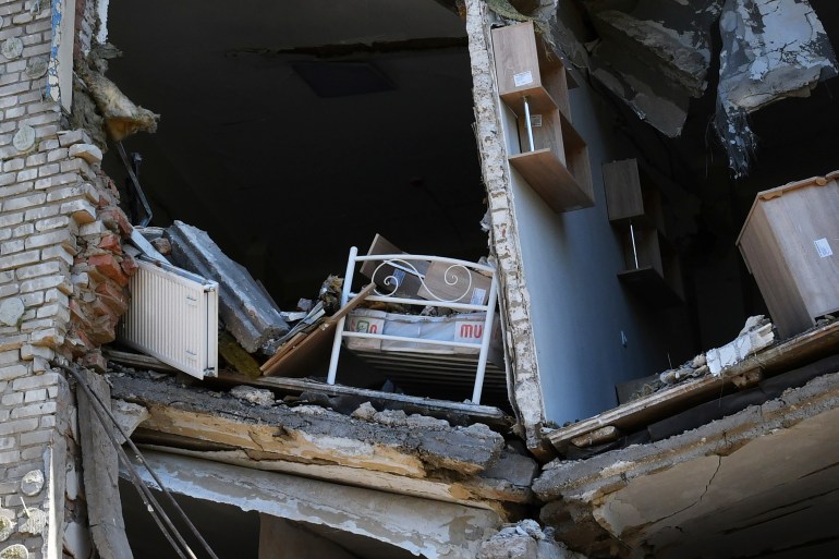 A child's bed inside an apartment building damaged by Russian shelling in Bakhmut, Donetsk region