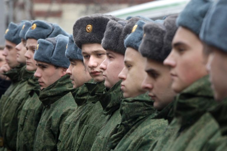 Russian military conscripts line up at a conscription point in Moscow.