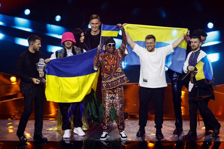The Kalush Orchestra from Ukraine takes the stage after winning the Eurovision Song Contest 2022 in Turin, Italy on May 15, 2022 [Yara Nardi/Reuters]