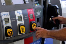 A customer pumps gas at an Exxon gas station