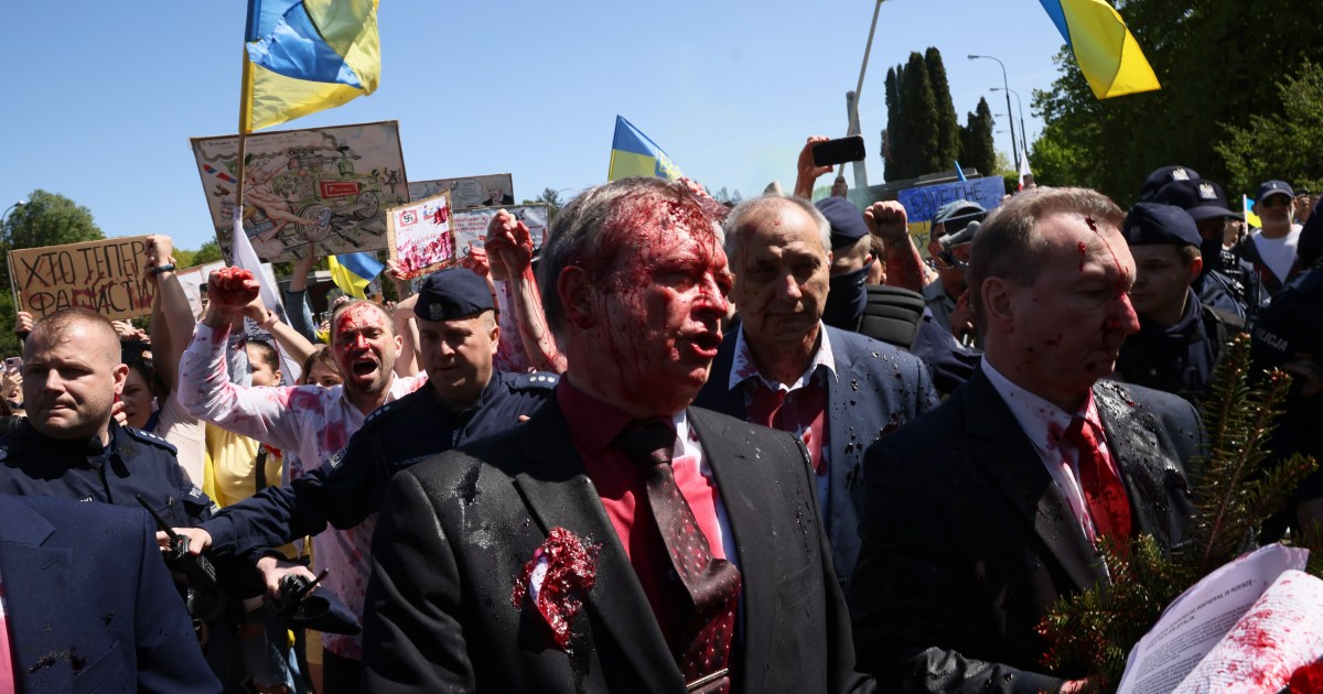 fascist-murderer-russian-envoy-to-poland-doused-in-red-paint
