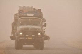 A truck drives through a Spring sandstorm in the southern Iraqi city of Nasiriya in the Dhi Qar province.