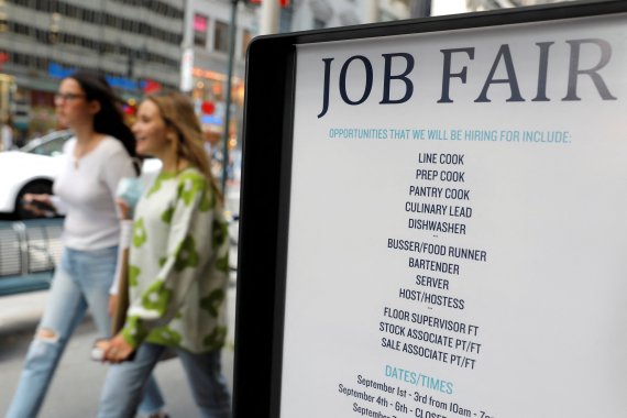 Signage for a job fair is seen on 5th Avenue in Manhattan, New York City, U.S.