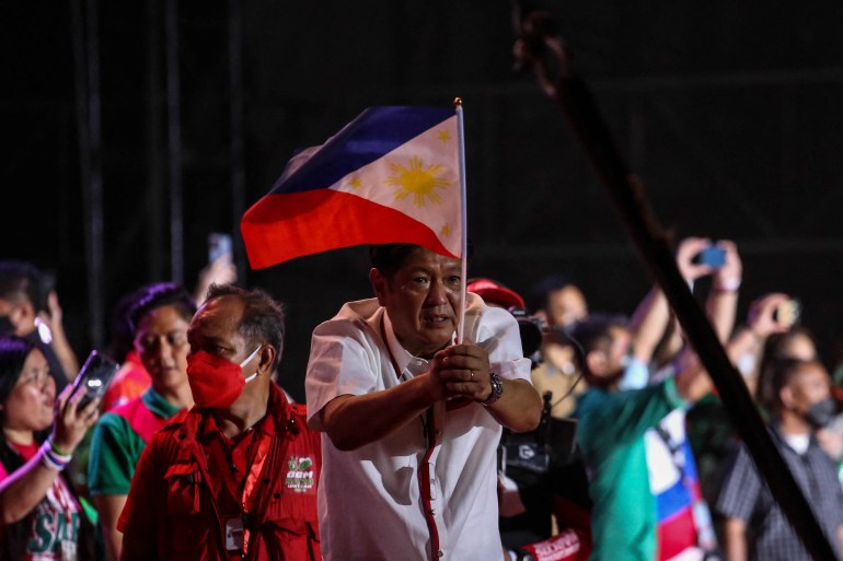 Philippines presidential candidate Ferdinand Marcos Jr greets his supporters during the last day of campaign rally at Paranaque City, suburban Manila on May 7, 2022 [Jam Sta Rosa/ AFP]
