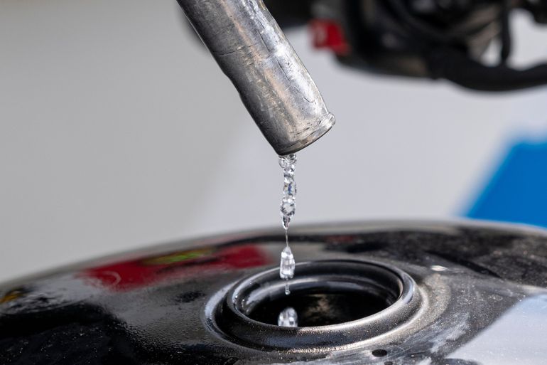 Gasoline drips out of a fuel nozzle at a gas station in San Francisco, California, U.S.