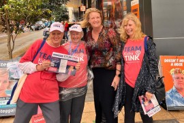 Kylea Tink poses with some of her team while campaigning in North Sydney