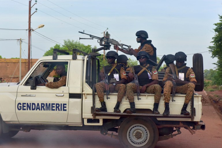 Burkinabe gendarmes sitting on their vehicle in the city of Ouhigouya in the north of the country in 2018 [File photo Issouf Sanogo/AFP]