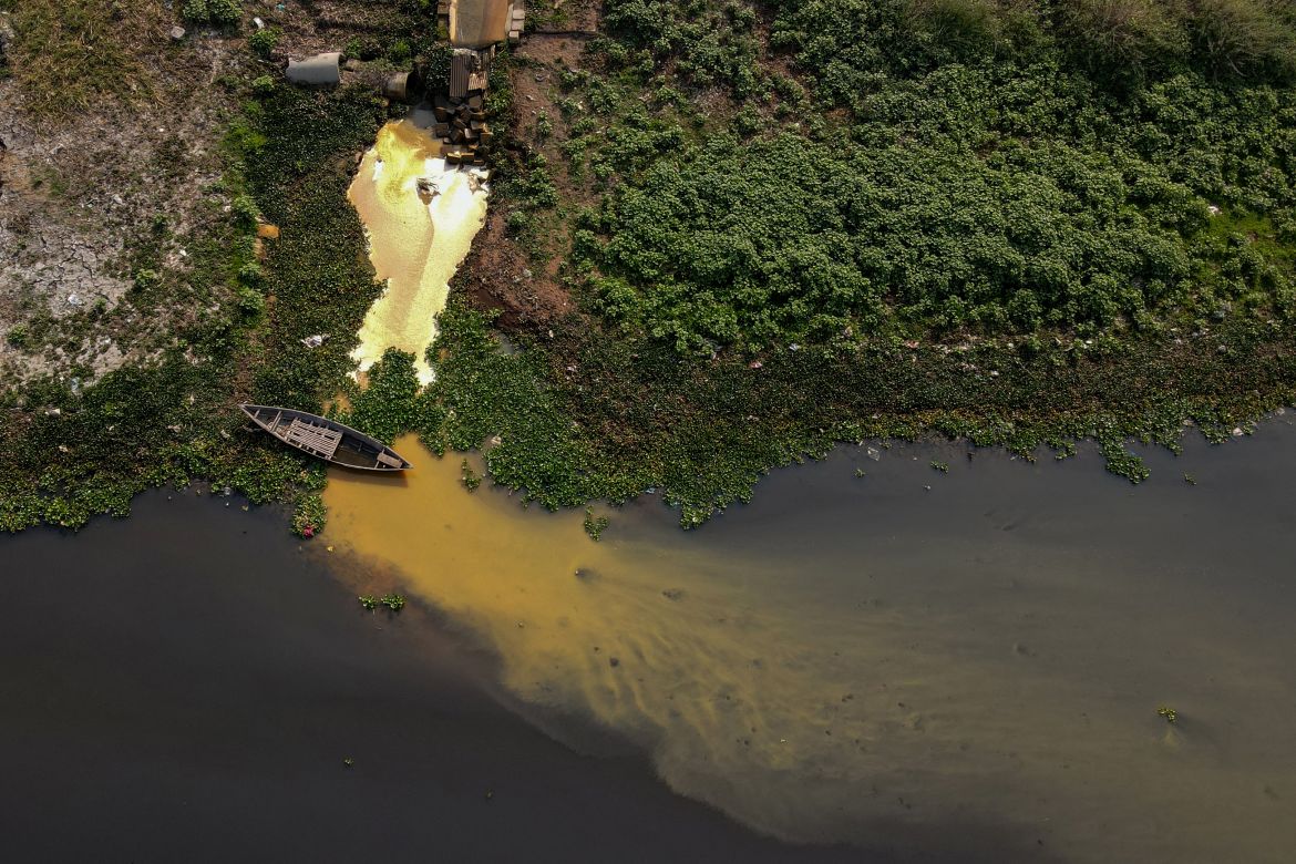 In this aerial picture taken on March 5, 2022, industrial effluents enter the waters of the Shitolokkhya River in Narayangong. - Bangladesh