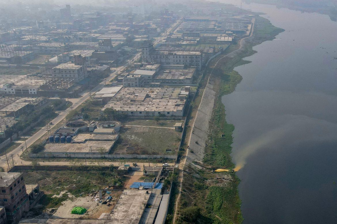 In this aerial picture taken on March 5, 2022, industrial effluents enter the waters of the Shitolokkhya River in Narayangong