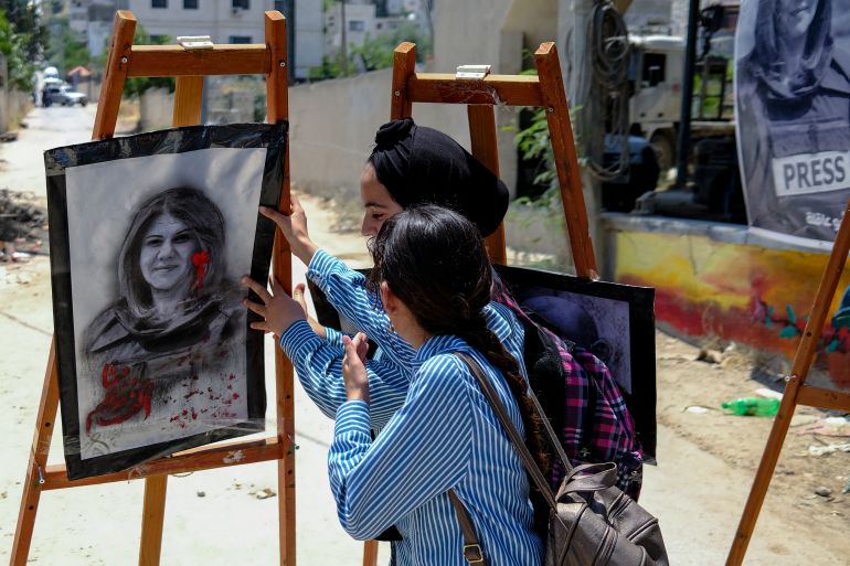 Palestinian schoolgirls at an art exhibit honouring slain Al Jazeera journalist Shireen Abu Akleh in May 2022 at the spot where she was killed in Jenin, in the occupied West Bank.