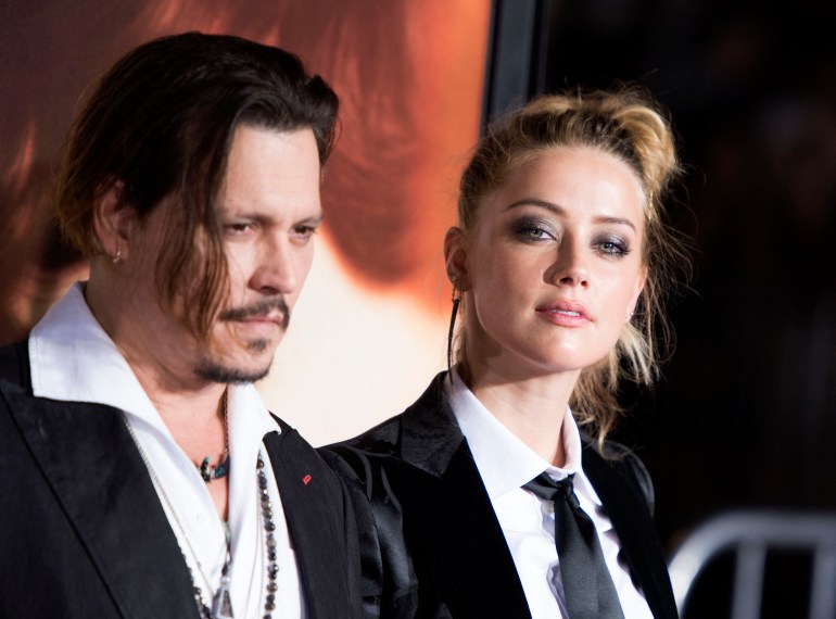(FILES) In this file photo taken on November 21, 2015 Actors Johnny Depp (L) and Amber Heard attend the Los Angeles Premiere of "The Danish Girl", in Westwood, California. - A US jury on June 1, 2022found Johnny Depp and Amber Heard defamed each other, but sided far more strongly with the "Pirates of the Caribbean" star following an intense libel trial involving bitterly contested allegations of sexual violence and domestic abuse. (Photo by VALERIE MACON / AFP)
