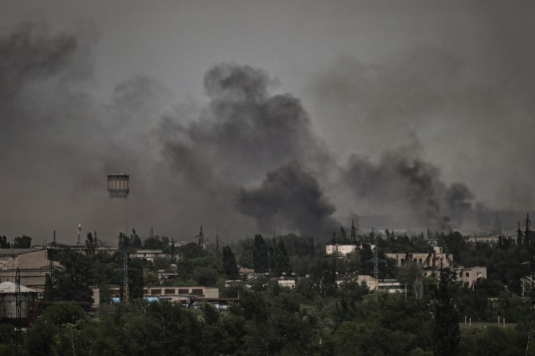Smoke and dirt rise in the city of Severodonetsk 