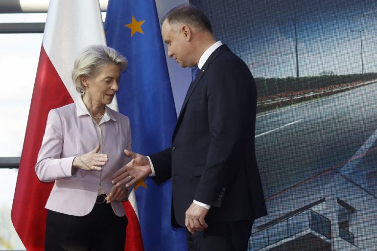 European Commission President Ursula von der Leyen shakes hands with Polish President Andrzej Duda following a joint press conference